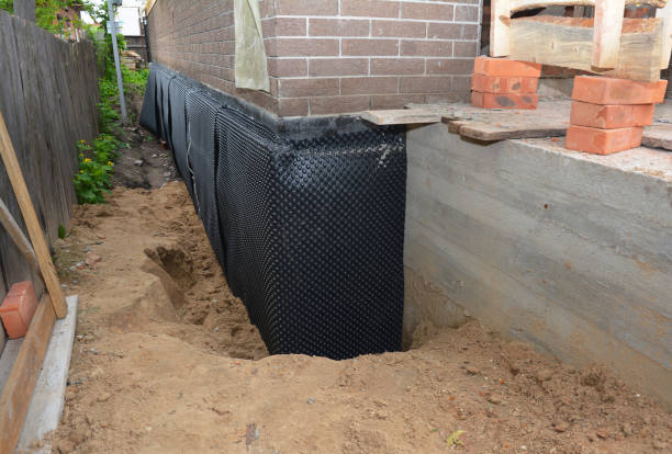 Happy homeowners after waterproofing job in Sea Cliff